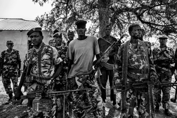 Sudan People's Liberation Army (SPLA) government soldiers from the 2nd Battalion pose at the SPLA headquarters in Nyang, in the county of Yirol East, South Sudan.