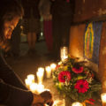 A woman lights a candle during a vigil in remembrance of the victims of a fire at a children's shelter, outside the morgue where the bodies are being identified in Guatemala City, Wednesday, March 8, 2017. Authorities say at least 22 girls have died after a fire at the children's shelter Virgin of the Assumption Safe Home, which was created to house children who were victims of abuse, homelessness or who had completed sentences at youth detention centers and had nowhere else to go. (AP Photo/Moises Castillo) Guatemala Fire